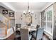Elegant dining room with a round table, stylish chairs, and a large window with natural light at 2471 Bridlewood Se Dr # 8, Atlanta, GA 30339