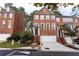 Charming three-story brick townhome with an attached garage and well-maintained landscaping at 2471 Bridlewood Se Dr # 8, Atlanta, GA 30339