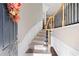 Warm and welcoming foyer showcasing a staircase with wood and iron detailing at 2471 Bridlewood Se Dr # 8, Atlanta, GA 30339