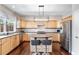 Well-equipped kitchen featuring stainless steel appliances, light wood cabinets, and a central island with seating at 2471 Bridlewood Se Dr # 8, Atlanta, GA 30339