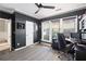 Home office featuring black walls, a ceiling fan, and a view into the hallway at 2471 Bridlewood Se Dr # 8, Atlanta, GA 30339