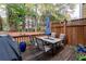 Outdoor patio area features a wooden deck and an outdoor dining set at 2471 Bridlewood Se Dr # 8, Atlanta, GA 30339