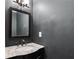 Powder room featuring a marble countertop sink and a dark-colored wall at 2471 Bridlewood Se Dr # 8, Atlanta, GA 30339