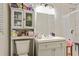 A functional bathroom includes built-in storage above the toilet and a shower with classic white subway tiles at 5626 Noblett Sw Rd, Stone Mountain, GA 30087