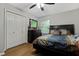 Comfortable bedroom with hardwood floors, ample closet space, and soft, neutral decor for a relaxing feel at 5626 Noblett Sw Rd, Stone Mountain, GA 30087