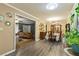 Dining room with hardwood floors adjacent to a living room filled with natural light at 5626 Noblett Sw Rd, Stone Mountain, GA 30087