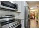 An eat-in kitchen featuring stainless appliances, subway tile backsplash, and an easy flow into dining area at 5626 Noblett Sw Rd, Stone Mountain, GA 30087