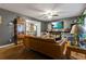 Comfortable living room with a ceiling fan, large windows, and hardwood floors at 5626 Noblett Sw Rd, Stone Mountain, GA 30087