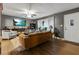 Comfortable living room with a ceiling fan, large windows, and hardwood floors at 5626 Noblett Sw Rd, Stone Mountain, GA 30087