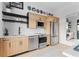 Modern kitchen featuring stainless steel appliances, light wood cabinetry, and stylish decor at 567 Ponce De Leon Ne Ave # 415, Atlanta, GA 30308