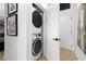 Convenient laundry closet with stacked washer and dryer, maximizing space at 567 Ponce De Leon Ne Ave # 415, Atlanta, GA 30308
