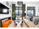 Inviting living room with large windows, modern decor, and comfortable seating at 567 Ponce De Leon Ne Ave # 415, Atlanta, GA 30308