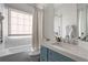 Bright bathroom with a bathtub, shower and large window providing natural light at 1477 Village Park Ne Ct, Atlanta, GA 30319