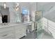 Luxurious bathroom with double vanity, marble countertops, and a glass-enclosed shower at 1477 Village Park Ne Ct, Atlanta, GA 30319