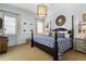 Serene bedroom with a four-poster bed, neutral color palette, and ample natural light at 1477 Village Park Ne Ct, Atlanta, GA 30319