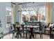 Bright dining room features a wooden table, metal chairs and large windows at 1477 Village Park Ne Ct, Atlanta, GA 30319