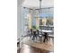 Light-filled dining room featuring a wooden table, metal chairs, and neutral décor at 1477 Village Park Ne Ct, Atlanta, GA 30319