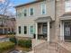 Beautiful multi-story home with brick and stucco accents, featuring an inviting front porch at 1477 Village Park Ne Ct, Atlanta, GA 30319