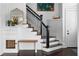 Welcoming foyer with staircase, custom storage, and elegant decor at 1477 Village Park Ne Ct, Atlanta, GA 30319