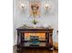 Foyer table with decorative bowls and lighting fixtures against light-colored walls at 1477 Village Park Ne Ct, Atlanta, GA 30319
