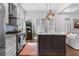 Modern kitchen with stainless steel appliances, an island, and white cabinetry at 1477 Village Park Ne Ct, Atlanta, GA 30319