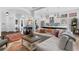 Open-concept living space with hardwood floors, neutral tones, and a view of the modern kitchen at 1477 Village Park Ne Ct, Atlanta, GA 30319