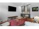 Spacious living room includes a large flat screen television, couch, and a built in bar at 1477 Village Park Ne Ct, Atlanta, GA 30319
