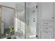 Modern glass shower with marble tile and dual showerheads at 1477 Village Park Ne Ct, Atlanta, GA 30319