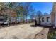 View of the back patio area with a covered porch and exterior siding at 1722 Johnston Nw Trl, Kennesaw, GA 30152