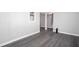 Finished basement with gray wood-look flooring and neutral walls at 1722 Johnston Nw Trl, Kennesaw, GA 30152