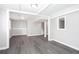 Finished basement featuring modern gray wood-look flooring and neutral walls at 1722 Johnston Nw Trl, Kennesaw, GA 30152
