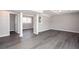 Spacious finished basement with gray vinyl flooring and natural light at 1722 Johnston Nw Trl, Kennesaw, GA 30152