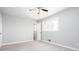 Bright bedroom with soft gray carpet and a large window allowing natural light at 1722 Johnston Nw Trl, Kennesaw, GA 30152