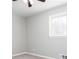 Neutral bedroom with a ceiling fan, a window providing natural light, and soft gray carpet at 1722 Johnston Nw Trl, Kennesaw, GA 30152