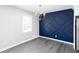 Cozy dining area with modern lighting and accent wall at 1722 Johnston Nw Trl, Kennesaw, GA 30152