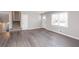 Spacious living room features modern gray flooring and plenty of natural light at 1722 Johnston Nw Trl, Kennesaw, GA 30152
