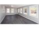 Open room with plenty of natural light and wood-look flooring at 1722 Johnston Nw Trl, Kennesaw, GA 30152