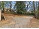Home with a large backyard and gravel parking area at 1815 Monroe Ne Dr, Atlanta, GA 30324