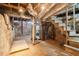 Unfinished basement featuring brick foundation, exposed ductwork, and concrete flooring at 1815 Monroe Ne Dr, Atlanta, GA 30324