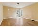 Bedroom with hardwood floors and natural light from the adjacent backyard at 1815 Monroe Ne Dr, Atlanta, GA 30324