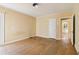 Bedroom featuring hardwood floors, natural light, and a classic white door at 1815 Monroe Ne Dr, Atlanta, GA 30324