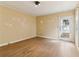 Bright bedroom with hardwood floors and a door to the backyard at 1815 Monroe Ne Dr, Atlanta, GA 30324