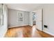 Bedroom features hardwood floors, neutral walls, natural light, and an ensuite door at 1815 Monroe Ne Dr, Atlanta, GA 30324