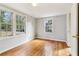 Bright bedroom showing hardwood floors, multiple windows and neutral walls at 1815 Monroe Ne Dr, Atlanta, GA 30324