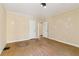 Bright bedroom featuring hardwood floors and a view of the entry to another room at 1815 Monroe Ne Dr, Atlanta, GA 30324