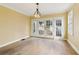Dining room featuring glass doors and a vintage light fixture, ideal for gatherings at 1815 Monroe Ne Dr, Atlanta, GA 30324