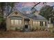 Charming, one-story brick home with bay window, chimney, black shutters and an inviting front entrance at 1815 Monroe Ne Dr, Atlanta, GA 30324