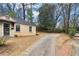 View of home exterior and driveway with car at 1815 Monroe Ne Dr, Atlanta, GA 30324