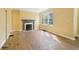 Charming living room showcasing a decorative fireplace and natural light with large windows at 1815 Monroe Ne Dr, Atlanta, GA 30324