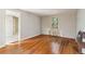 Room featuring a window, wood floors, painted grey walls, and a heater at 1815 Monroe Ne Dr, Atlanta, GA 30324